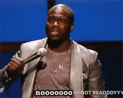 A Man In A Suit Is Holding A Microphone And Saying `` Im Not Readdddyy '' . GIF