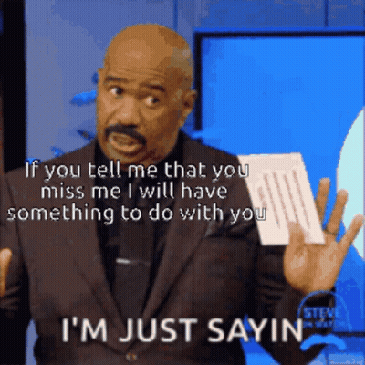 A Man In A Suit Is Holding A Piece Of Paper And Says " If You Tell Me That You Miss Me GIF