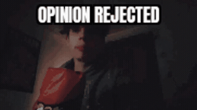 A Man In A Suit Is Holding A Piece Of Paper That Says Opinion Rejected On It GIF
