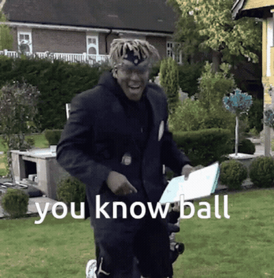 A Man In A Suit Is Holding A Piece Of Paper That Says " You Know Ball " On It GIF