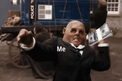 A Man In A Suit Is Holding A Stack Of 100 Dollar Bills In His Hand . GIF