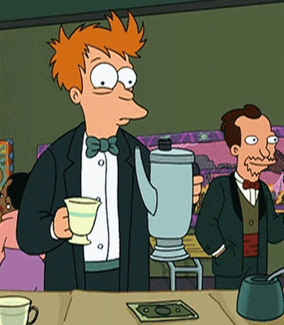 A Man In A Suit Is Holding A Teapot And A Cup GIF
