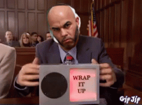 A Man In A Suit Is Holding A Wrap It Up Button GIF