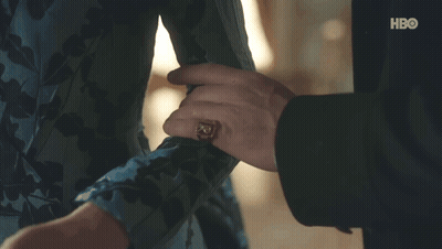 A Man In A Suit Is Holding Another Man 'S Hand . GIF