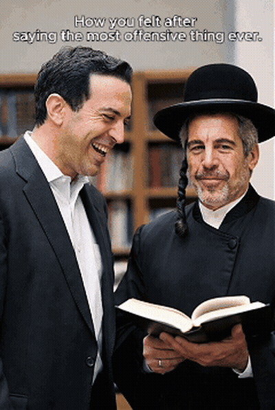 A Man In A Suit Is Laughing Next To A Man In A Hat Who Is Holding A Book GIF