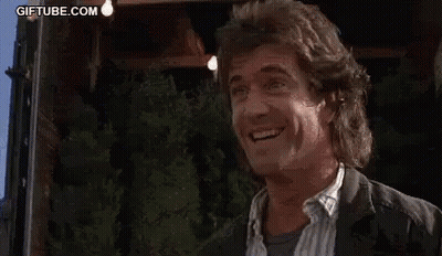 A Man In A Suit Is Laughing While Being Punched In The Face By A Woman . GIF