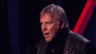 A Man In A Suit Is Making A Funny Face And Says Blah Blah Blah Blah Blah Blah Blah Blah GIF