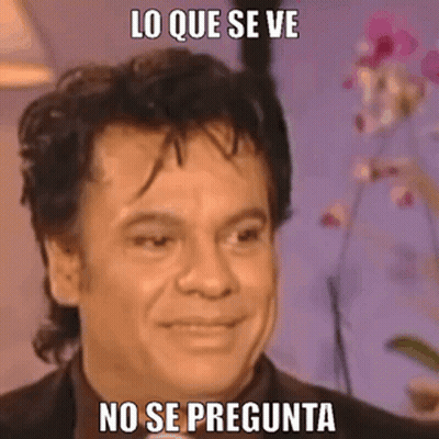 A Man In A Suit Is Making A Funny Face With A Meme . GIF