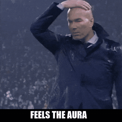 A Man In A Suit Is Making A Funny Face With The Words " Feels The Aura " Above Him GIF