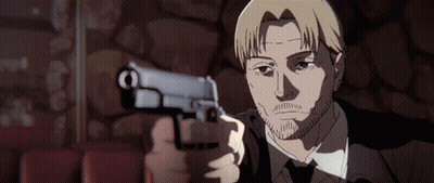 A Man In A Suit Is Pointing A Gun At The Camera GIF