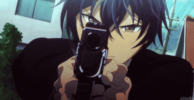 A Man In A Suit Is Pointing A Gun At The Camera .. GIF