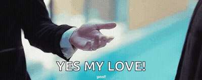 A Man In A Suit Is Pointing At Another Man With The Words Yes My Love Written Below Him GIF