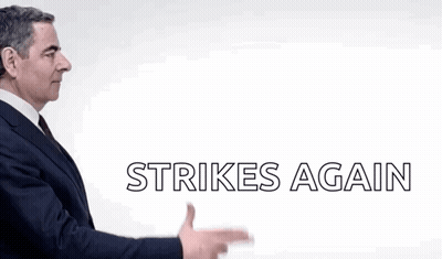 A Man In A Suit Is Pointing At Something With The Words Strikes Again Below Him GIF