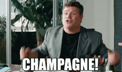 A Man In A Suit Is Saying Champagne GIF