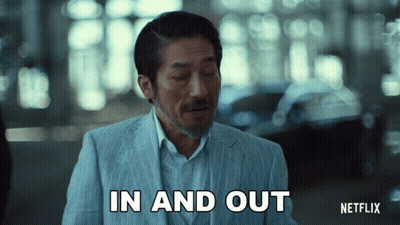 A Man In A Suit Is Saying In And Out GIF