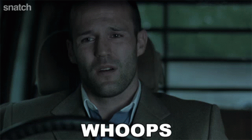 A Man In A Suit Is Saying Whoops In A Car GIF
