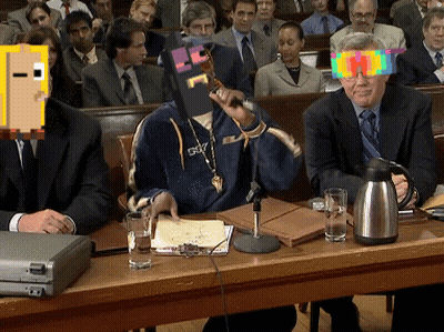 A Man In A Suit Is Sitting At A Table With A Briefcase And Glasses On It GIF