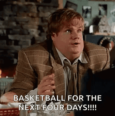 A Man In A Suit Is Sitting At A Table With A Glass Of Beer And A Cigarette In His Hand . GIF