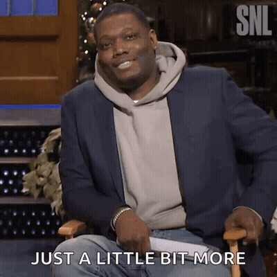A Man In A Suit Is Sitting In A Chair With The Words Just A Little Bit More Behind Him GIF