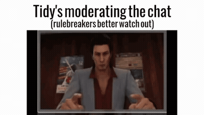 A Man In A Suit Is Sitting In Front Of A Computer Screen And Talking On A Video Call . GIF