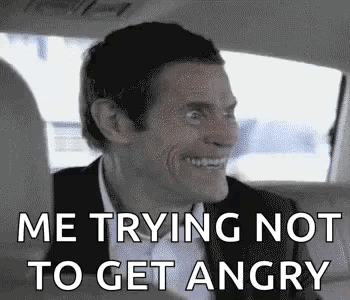 A Man In A Suit Is Sitting In The Back Seat Of A Car . GIF