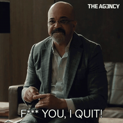 A Man In A Suit Is Sitting On A Couch And Says " F ** You I Quit " GIF