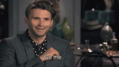 A Man In A Suit Is Smiling And Saying Go Me . GIF