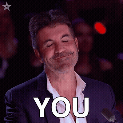 A Man In A Suit Is Smiling And Says You GIF