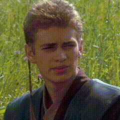 A Man In A Suit Is Standing In A Field Of Grass GIF