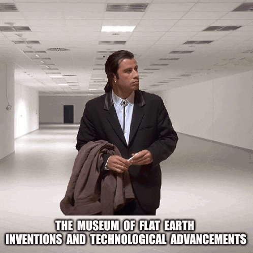 A Man In A Suit Is Standing In An Empty Hallway With The Words The Museum Of Flat Earth Inventions And Technological Adv GIF