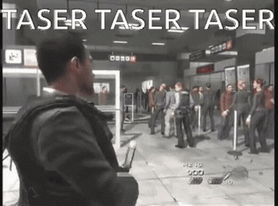 A Man In A Suit Is Standing In Front Of A Crowd In A Video Game With The Words Taser Taser Taser GIF