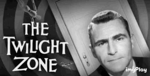 A Man In A Suit Is Standing In Front Of A Door With The Words The Twilight Zone Above Him . GIF