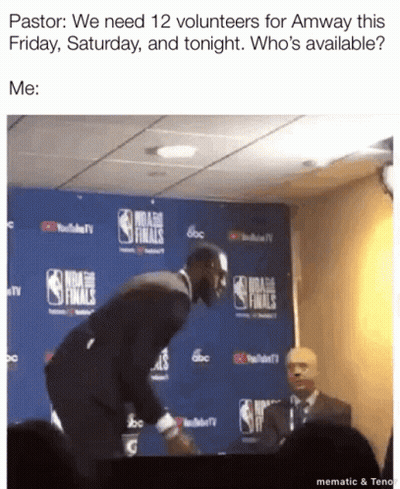 A Man In A Suit Is Standing In Front Of A Nba Finals Sign GIF
