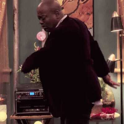 A Man In A Suit Is Standing In Front Of A Pioneer Stereo GIF
