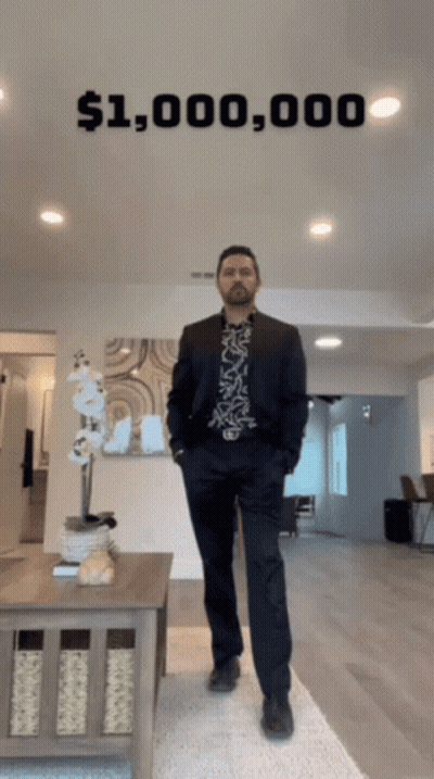 A Man In A Suit Is Standing In Front Of A Sign That Says $ 1,000,000 GIF