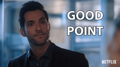 A Man In A Suit Is Standing In Front Of A Sign That Says " Good Point " GIF