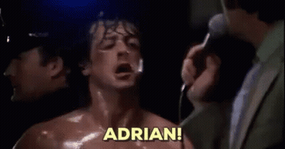 A Man In A Suit Is Standing Next To A Man In A Boxing Ring With His Mouth Open . GIF