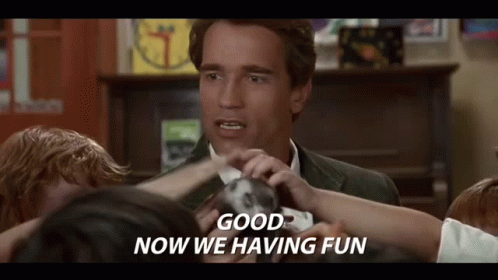 A Man In A Suit Is Surrounded By Children And Says `` Good Now We 'Re Having Fun '' . GIF