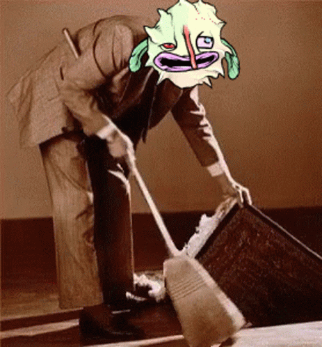 A Man In A Suit Is Sweeping A Floor With A Cartoon Face On His Head GIF