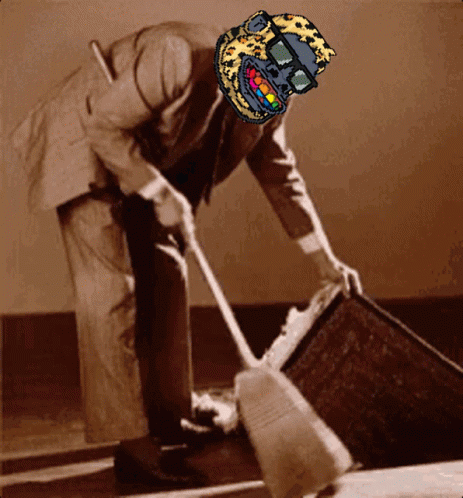 A Man In A Suit Is Sweeping The Floor With A Leopard Print Mask On His Head GIF
