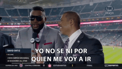 A Man In A Suit Is Talking Into A Microphone While Another Man Says Yo No Se Ni Por GIF