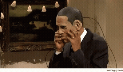 A Man In A Suit Is Talking On A Cell Phone In Front Of A Framed Painting GIF