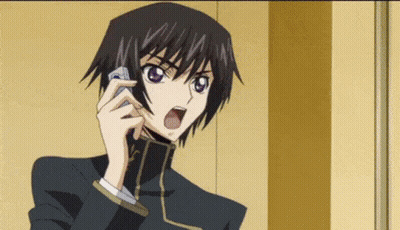 A Man In A Suit Is Talking On A Cell Phone . GIF