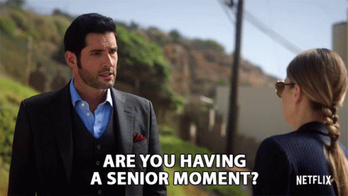 A Man In A Suit Is Talking To A Woman And The Words Are You Having A Senior Moment GIF