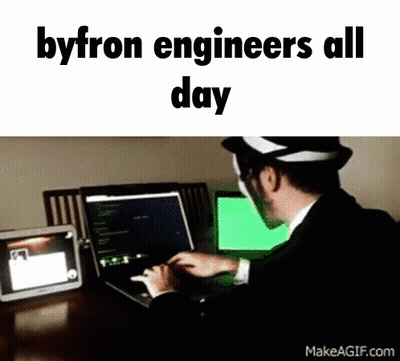A Man In A Suit Is Typing On A Laptop With The Words Byron Engineers All Day Below Him GIF