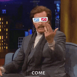 A Man In A Suit Is Wearing 3D Glasses And Giving The Middle Finger . GIF