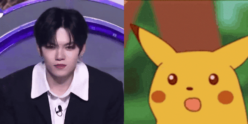 A Man In A Suit Next To A Picture Of A Cartoon Character GIF