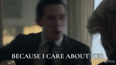 A Man In A Suit Says " Because I Care About Her " In Front Of A Woman GIF