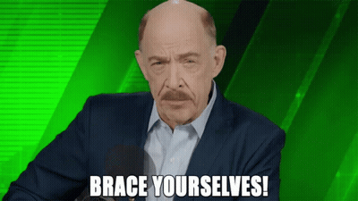 A Man In A Suit Says Brace Yourselfs In Front Of A Green Background GIF