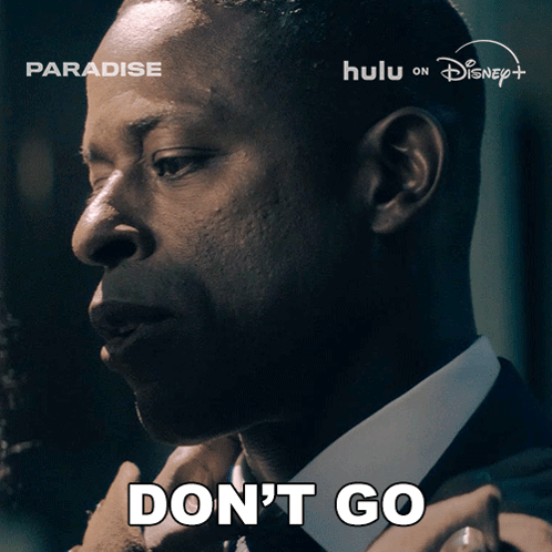 A Man In A Suit Says " Don 'T Go " GIF
